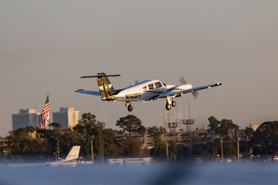 FORT MYERS, FLORIDA, USA - 15 FEB 2024. 2022 PIPER ARCHER III, PA-28-181 takes off from Page Field Airport in Fort Myers on the Gulf Coast. Florida, USA