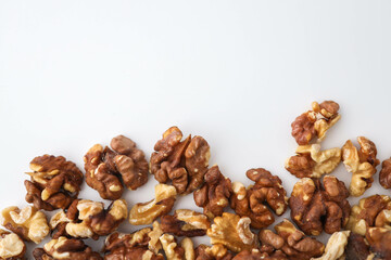 Roasted walnuts on white background