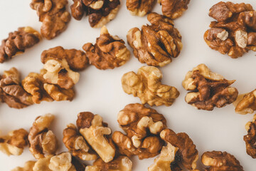 Roasted walnuts on white background