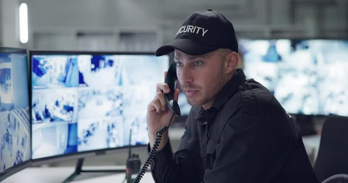 Man, phone call or talking with cctv monitor for protection, security service and building safety check. Face, video surveillance agency or male guard in control room with footage or camera for crime