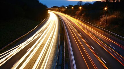 A bustling highway illuminated by streaks of car lights at night