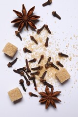 Different spices on white table, flat lay