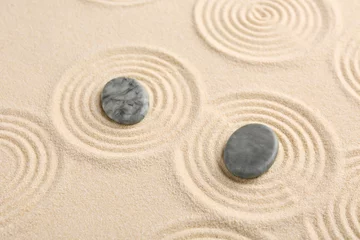 Fototapeten Zen garden stones on beige sand with pattern © New Africa