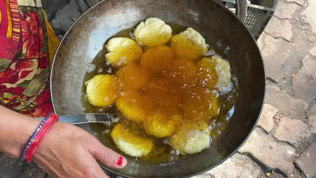 Thekua being deep fried in a local dhaba in Bihari Style
