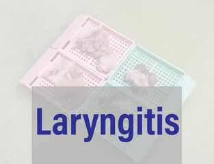 Laryngitis medical term with histology sample on cassette background, An inflammation of vocal cord (larynx) from overuse, irritation or infection.