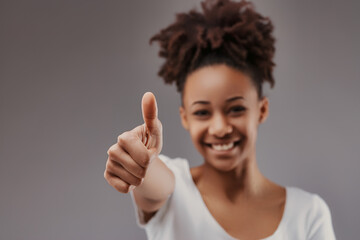 Thumbs-up reflects positivity, approachable and cheerful