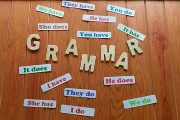 English grammar cards on wooden table