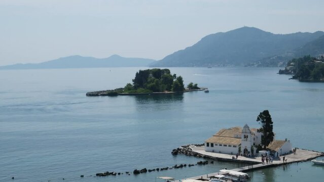 Monastery on the water, over which planes take off and land Greece Corfu island Vlacherna Monastery 