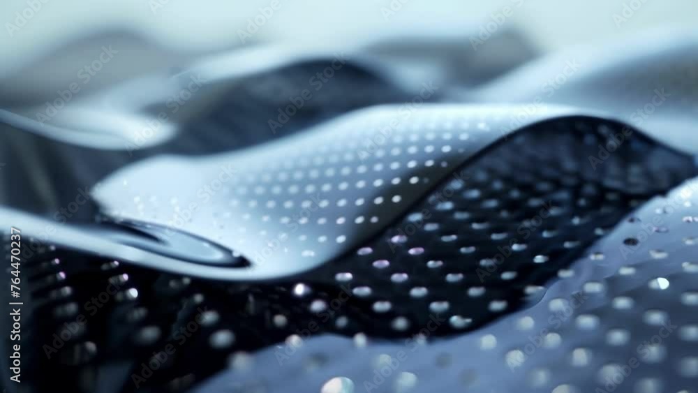 Poster a detailed view of a flexible graphenebased touchpad showcasing the materials malleability and its p