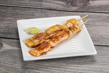 Grilled salmon skewer with sauce