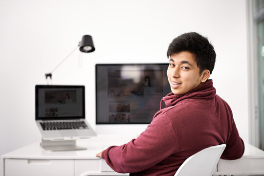 Happy man, portrait and computer screen for web development, programming and information technology. Asian programmer, worker or online designer on laptop or multimedia for startup project at desk