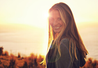 Sunset, happy and portrait of woman by ocean for adventure, relaxing and enjoy weekend outdoors....