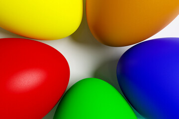 Painted Easter eggs lie on a white ceramic plate.