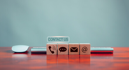 customer contact us, call center hotline service Concept .Wooden block with email, address, message, phone icons showing connection or support to online marketing services or online support - obrazy, fototapety, plakaty