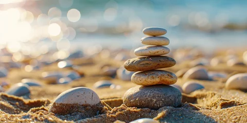Tuinposter Stack of rocks on beach © vefimov