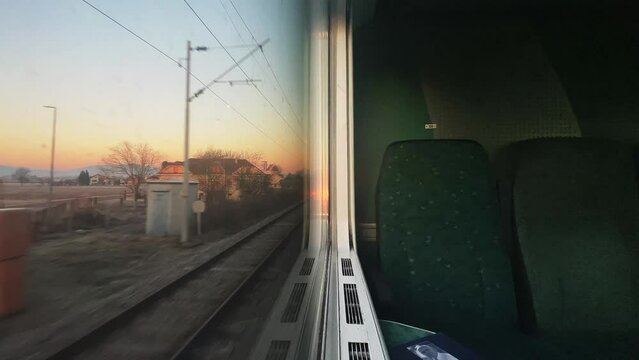 Time lapse train window view on sunrise Croatia, Slovenia