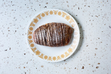 A top down view of a chocolate raspberry filled croissant.