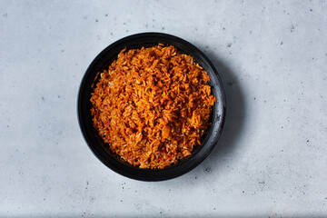 A top down view of a bowl of jollof rice.
