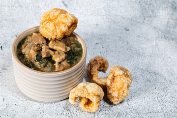 Traditional pork mungo served with pork crisps. 