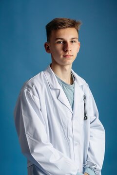 a young guy in a white coat blue background  The style is reminiscent of product photography