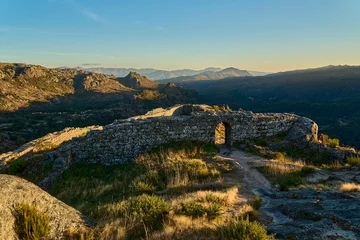 Medieval Castle Ruins of Castro Laboreiro high on a cliff in the mountains of northern Portugal inside Geras national park.