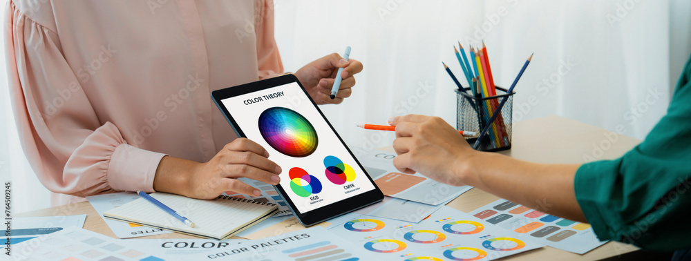 Poster a cropped picture of professional designer selects the color by using color theory and comparing wit