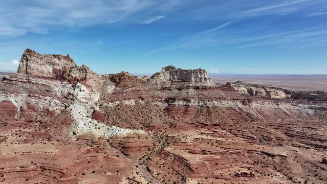 Aerial Temple Mountain Utah desert approaching 3. San Rafael Swell geologic environment southern Utah. Abandoned uranium mines. Giant sandstone rocks valleys, canyons, gorges, mesas. Travel. 
