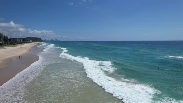 Waves Coming To The Shoreline Of Beach In Palm Beach, Gold Coast, Australia. - aerial shot