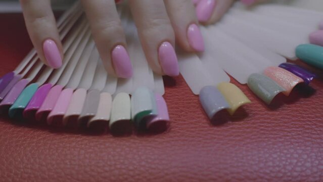 Girl choosing colours for her nails
