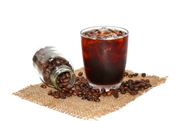 Americano ice coffee and Coffee beans and coffee grinder vintage style put on old wooden in white background.