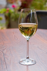 white wine on the wooden table