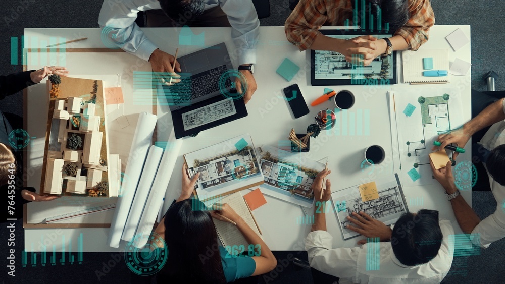 Aufkleber top down aerial view of team looking at blueprint and talking about financial chart or investment st