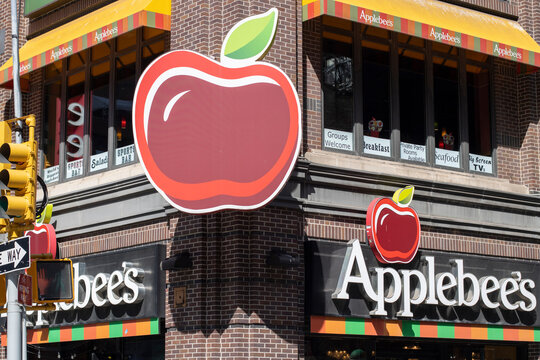 New York, NY, USA - July 4, 2022: Exterior view of the Applebee's Grill and Bar restaurant at the 50th and Broadway in New York City. Applebee's is an American casual dining restaurant chain.