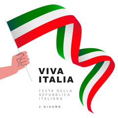 Human hand holds a long Italian flag on a stick. Viva Italia. Republic Day of Italy, June 2 - inscription in Italian.