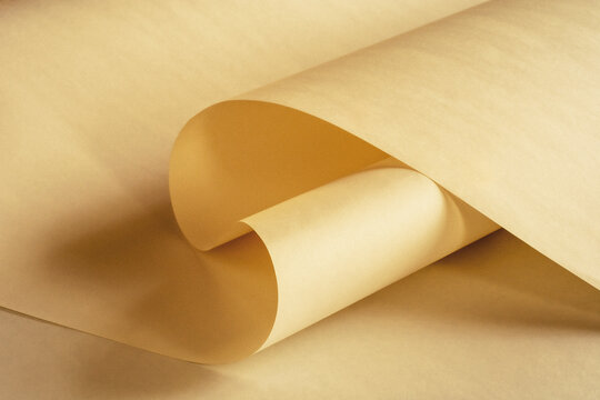 A large long sheet of paper in a warm vintage color as a background.