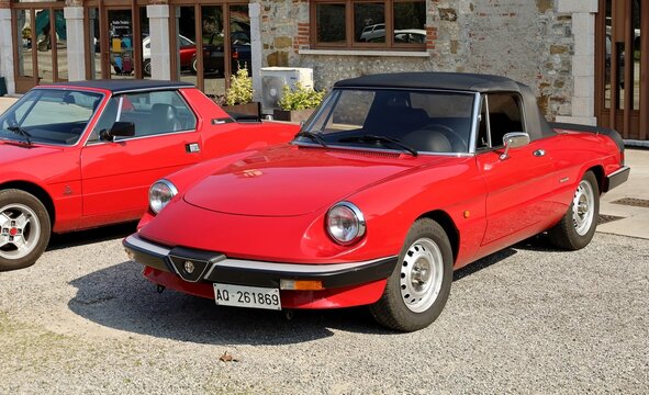 Percoto, Italy. March 17, 2024. Red Alfa Romeo Spider, legendary sports car of the italian automaker, before a classic cars parade