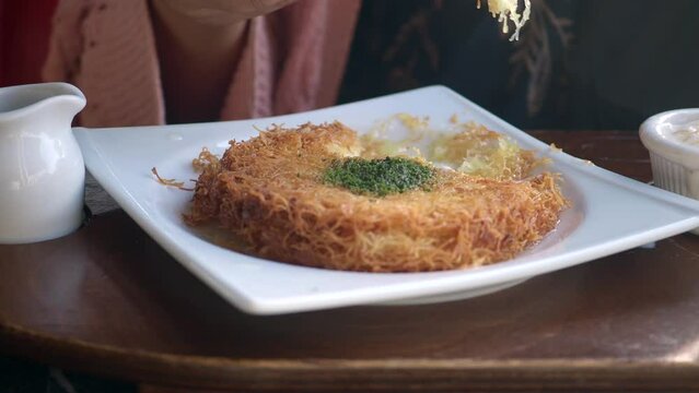 Turkish dessert kunefe, kunafa, kadayif with pistachio 