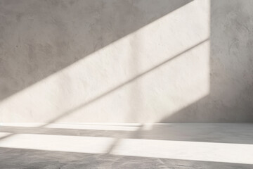 Sunlight casting sharp diagonal shadows on a textured white wall and floor