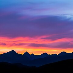 Obraz premium Scenic sunset in the mountains with vibrant orange and pink hues casting a warm glow over the rugged peaks.