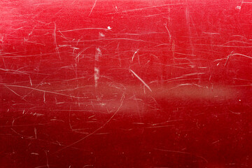 Red surface with scratches.