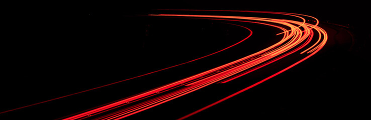 Fototapeta na wymiar red car lights at night. long exposure