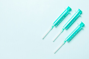 Top view of medical syringes on colorful background. Health care concept with copy space