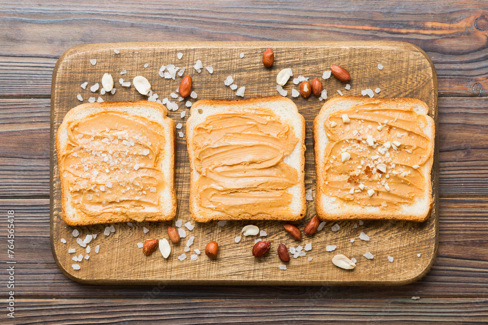 Wall mural Peanut butter sandwiches or toasts on light table background.Breakfast. Vegetarian food. American cuisine top view vith copy space