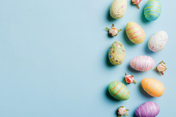 Happy Easter concept. Preparation for holiday. Easter eggs on colored background. flat lay top view copy space banner