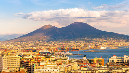 urban view on a Naples city with houses buildings and mount Vesuveus with amazing cloudy sky on background of landscape