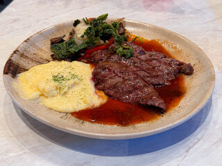 beef steak in ceramic plate