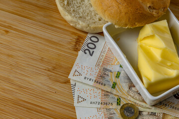 Increase in food prices in Poland, bread, butter on a cutting board, tomatoes, sausage, VAT on food