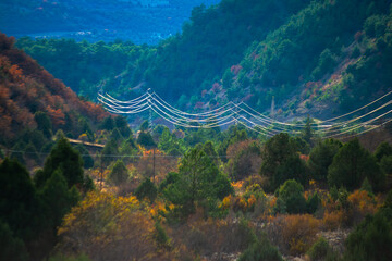 Powerful Pathways: Mountain, Road, and Distant Cables
