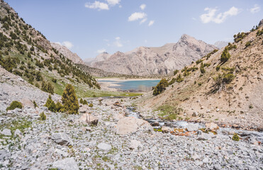 View of Lake Kulikalon and the Kulikalon Basin from a mountainside in the Fan Mountains in Tajikistan, atmosphere in the Tien Shan highlands