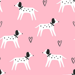 Fototapeta premium Cute hand drawn Dalmatian dogs with hand drawn kawaii hearts on a pink background, kids seamless pattern for textile and wrapping paper